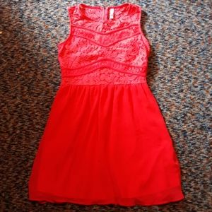 A neon orange zip-up dress